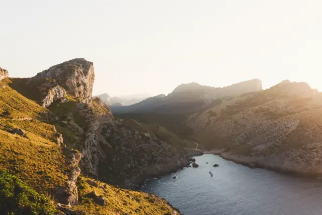 Sunlit cliffs above a narrow bay on Mallorca, in Kodak Gold 200
