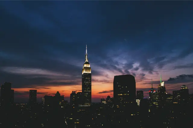 The Empire State Building against a deep blue and orange dusk sky, in Kodak Portra 800