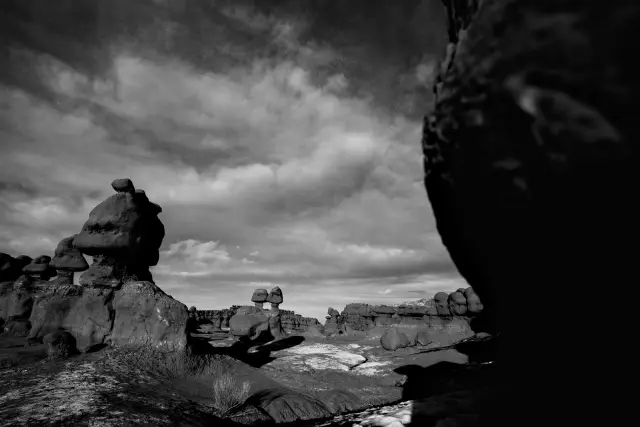 Orange rock formations under a stormy sky, in Kodak Tri-X 400