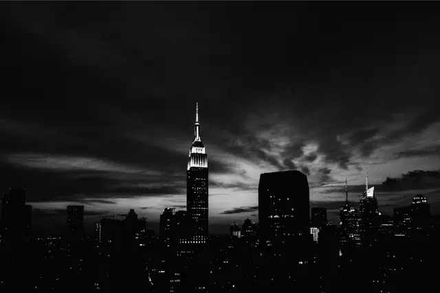 The Empire State Building against a deep blue and orange dusk sky, in MONO X 400