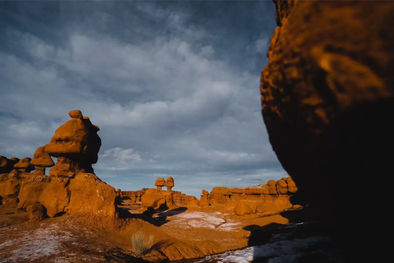 Orange rock formations under a stormy sky, unedited